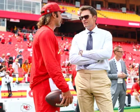 The NFL legend draws online backlash after being spotted in Raiders coaching booth
